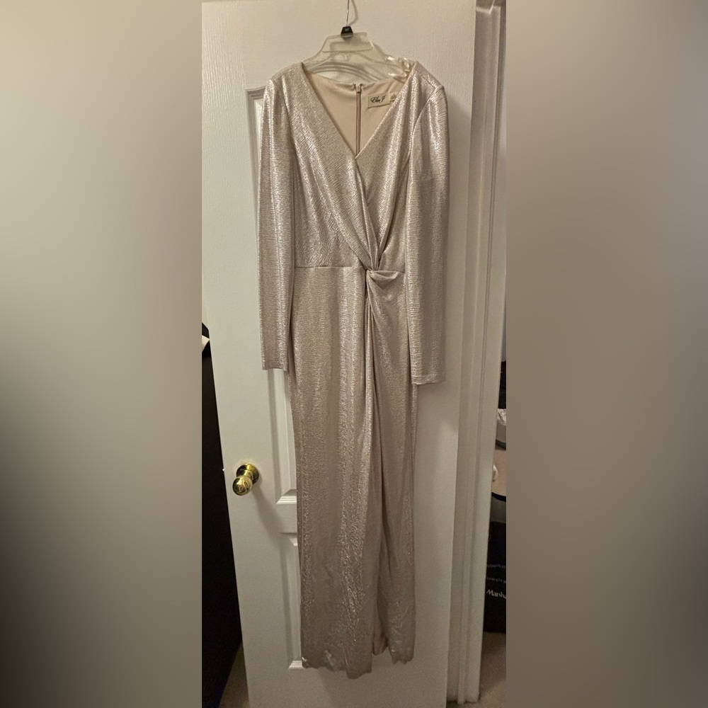 Size 10 Metalic long sleeved dress with mid-knot and  knee high slit. Worn once.
